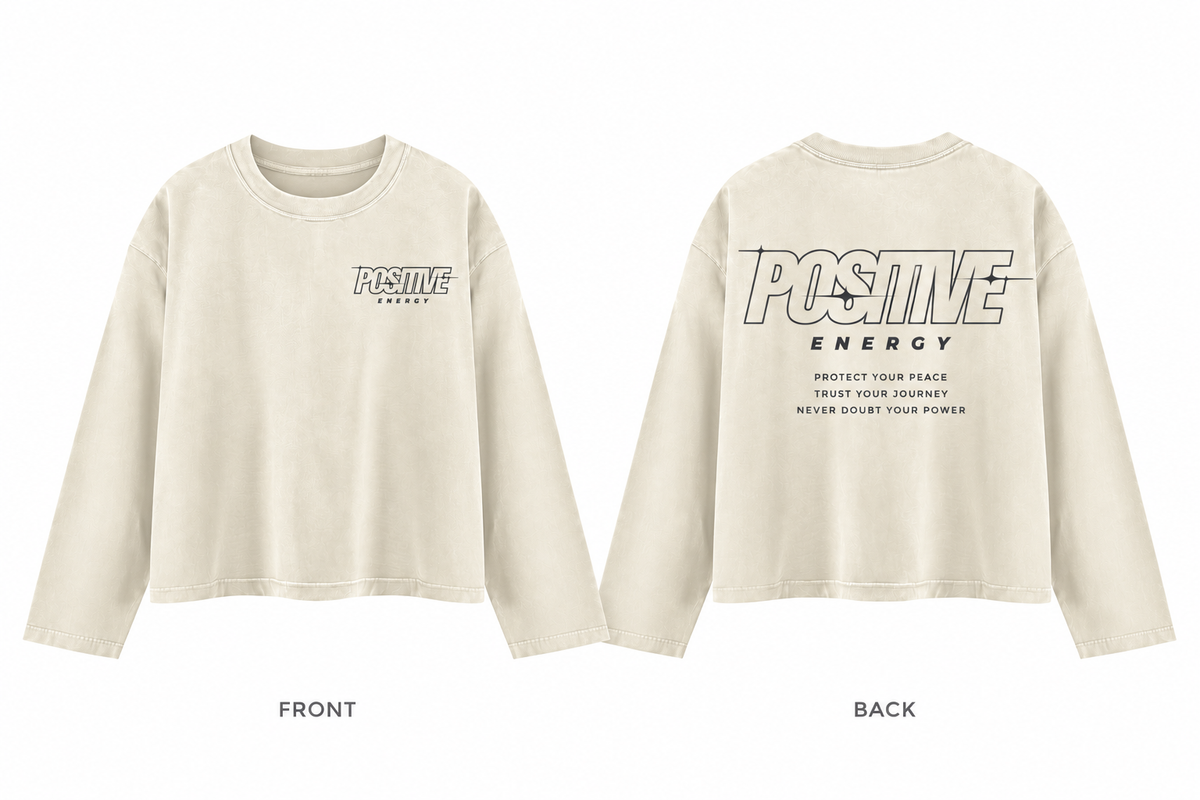 Positive Energy UT0275 in Apricot — printed front and back mockup; deep charcoal lettering